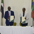 Sudan Defence Minister Yassin Ibrahim (L) and South Sudan Defense Minister Angelina Teny after signing the commitment agreement in Juba on Thursday 9th Sept. 2021 in Juba. [Photo:Radio Tamazuj]
